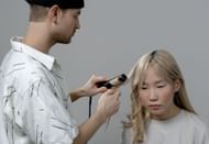 Using too much heat tools is not good for hair (Image via Pexels)
